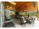 An inviting covered patio with wood ceilings, a built in grill and spacious seating area, perfect for outdoor entertaining at 2251 Everleigh Ln, Marietta, GA 30064