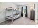 This bedroom features a bunk bed and a dresser with a lamp at 3623 Squires Park Ln, Loganville, GA 30052