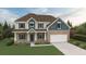 Charming two-story home with brick and siding exterior, manicured lawn and colorful flower beds at 3623 Squires Park Ln, Loganville, GA 30052