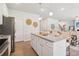 Modern kitchen with island, stainless steel appliances, and ample counter space at 3623 Squires Park Ln, Loganville, GA 30052