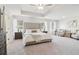 Spacious bedroom with tray ceiling, plush carpet, and plenty of natural light at 3623 Squires Park Ln, Loganville, GA 30052
