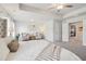 This is a view of the main bedroom which features a tray ceiling and sitting area at 3623 Squires Park Ln, Loganville, GA 30052