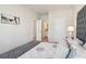 Comfortable bedroom with neutral decor, open doors, and ample natural light at 3623 Squires Park Ln, Loganville, GA 30052