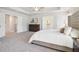 This spacious main bedroom offers a tray ceiling, sitting area, walk-in closet and en-suite bathroom at 3623 Squires Park Ln, Loganville, GA 30052