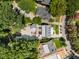 Aerial view of a modern home with multiple decks, outbuilding, driveway and professional landscaping at 542 Orme Ne Cir, Atlanta, GA 30306
