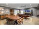 Finished basement with pool table, dining table, bar area, and painted walls at 542 Orme Ne Cir, Atlanta, GA 30306