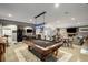 Finished basement with pool table, black refrigerator, tv, and seating area at 542 Orme Ne Cir, Atlanta, GA 30306
