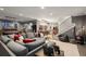 Finished basement with gray sofa, pool table, bar, shuffle board, and arcade games at 542 Orme Ne Cir, Atlanta, GA 30306