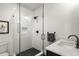 Contemporary bathroom with glass-enclosed shower and stylish marble vanity at 542 Orme Ne Cir, Atlanta, GA 30306
