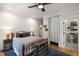 Bright bedroom with hardwood floors, ceiling fan, and ensuite bathroom access at 542 Orme Ne Cir, Atlanta, GA 30306