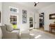 Serene bedroom with soft natural light, a comfortable armchair, and hardwood flooring at 542 Orme Ne Cir, Atlanta, GA 30306