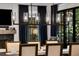 Dining room with seating for six and a linear chandelier with views to the fireplace at 542 Orme Ne Cir, Atlanta, GA 30306