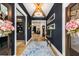 Elegant entryway with hardwood floors, stylish lighting, and a charming runner rug at 542 Orme Ne Cir, Atlanta, GA 30306