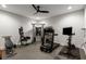 Finished basement with treadmill, weights, TV, and rubberized flooring at 542 Orme Ne Cir, Atlanta, GA 30306
