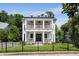 Stunning two-story home with a double-decker front porch, perfect for enjoying the outdoors at 542 Orme Ne Cir, Atlanta, GA 30306