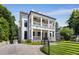 Elegant home with a charming double porch, manicured lawn, and inviting curb appeal at 542 Orme Ne Cir, Atlanta, GA 30306