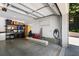 Spacious garage with storage shelving, a vehicle charger, and ample room at 542 Orme Ne Cir, Atlanta, GA 30306