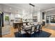 Modern kitchen with white cabinets, a large island, stainless steel appliances, and a dining area at 542 Orme Ne Cir, Atlanta, GA 30306