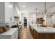 Spacious kitchen with white countertops and cabinets, stainless appliances and wooden island seating at 542 Orme Ne Cir, Atlanta, GA 30306