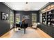 Sophisticated office with custom built-ins, a grand piano, and ample natural light at 542 Orme Ne Cir, Atlanta, GA 30306