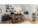 Bright home office with natural light, gallery wall, modern desk and hardwood floors at 542 Orme Ne Cir, Atlanta, GA 30306