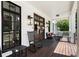 Inviting front porch featuring rocking chairs, a seating area, and stylish lighting fixtures at 542 Orme Ne Cir, Atlanta, GA 30306