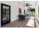 Covered porch with a charming porch swing, ceiling fans, and tile flooring at 542 Orme Ne Cir, Atlanta, GA 30306