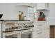 Close up of the stainless steel, professional style stove and oven with white cabinets in the background at 542 Orme Ne Cir, Atlanta, GA 30306