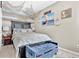 Nautical themed bedroom featuring a comfortable bed, blue accents, and coastal decor at 705 Sunset Ridge Se Ln, Lawrenceville, GA 30045