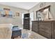 Nautical themed bedroom with dark wood furniture, light walls, and natural light at 705 Sunset Ridge Se Ln, Lawrenceville, GA 30045