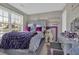 Comfortable bedroom with a large window and a decorative writing on the wall at 705 Sunset Ridge Se Ln, Lawrenceville, GA 30045