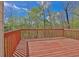 Red deck with trees in the background at 705 Sunset Ridge Se Ln, Lawrenceville, GA 30045