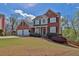 Beautiful two-story brick home with a two-car garage and well-manicured front yard at 705 Sunset Ridge Se Ln, Lawrenceville, GA 30045