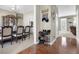 Inviting hallway with hardwood floors, decorative accents, and access to dining and living areas at 705 Sunset Ridge Se Ln, Lawrenceville, GA 30045