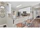 Bright kitchen features white cabinets, granite countertops, stainless steel appliances, and a breakfast bar with seating at 705 Sunset Ridge Se Ln, Lawrenceville, GA 30045
