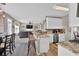 Open-concept kitchen overlooking the living room with granite countertops and modern appliances at 705 Sunset Ridge Se Ln, Lawrenceville, GA 30045