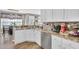 Bright kitchen with white cabinets, granite countertops, and stainless steel dishwasher at 705 Sunset Ridge Se Ln, Lawrenceville, GA 30045