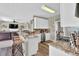 This modern kitchen offers granite counters, stainless appliances, white cabinets and transitions to a cozy living space at 705 Sunset Ridge Se Ln, Lawrenceville, GA 30045