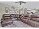 Spacious living room featuring a large sectional sofa and decorative wall decor at 705 Sunset Ridge Se Ln, Lawrenceville, GA 30045