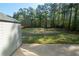 Large backyard featuring a lawn and partial view of the home from the shed at 170 Shoal Park Dr, Mcdonough, GA 30252