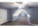 Cozy bedroom featuring a ceiling fan, window, and carpeted floors in an attic room at 170 Shoal Park Dr, Mcdonough, GA 30252