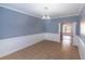 Bright dining room with elegant wainscoting and ceramic tile flooring at 170 Shoal Park Dr, Mcdonough, GA 30252