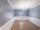 Bright dining room with elegant wainscoting and tile flooring at 170 Shoal Park Dr, Mcdonough, GA 30252