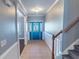 Home foyer features a blue front door with decorative glass and tiled flooring at 170 Shoal Park Dr, Mcdonough, GA 30252
