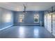 Clean garage with epoxy floor, overhead lighting, and windows for natural light at 170 Shoal Park Dr, Mcdonough, GA 30252