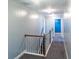 Second-floor hallway with carpet and wood banister leading to bedrooms at 170 Shoal Park Dr, Mcdonough, GA 30252