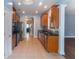 Open concept kitchen with tile flooring, stainless appliances, and granite countertops at 170 Shoal Park Dr, Mcdonough, GA 30252