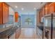 Modern kitchen with stainless steel appliances, granite countertops, and custom cabinetry at 170 Shoal Park Dr, Mcdonough, GA 30252