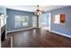 Spacious living room with hardwood floors, fireplace, and plenty of natural light at 170 Shoal Park Dr, Mcdonough, GA 30252