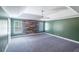 Spacious main bedroom with tray ceiling, wood accent wall and ample natural light at 170 Shoal Park Dr, Mcdonough, GA 30252